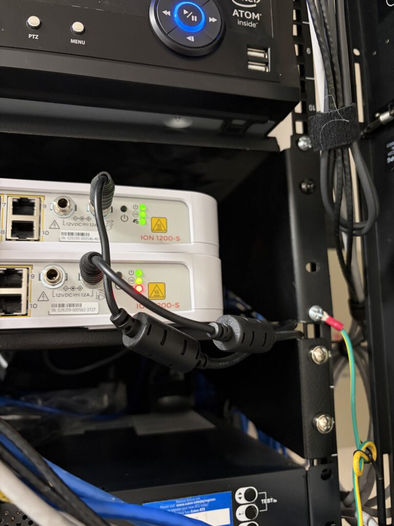 Network rack and cabling showing IT infrastructure issues that can affect daily operations